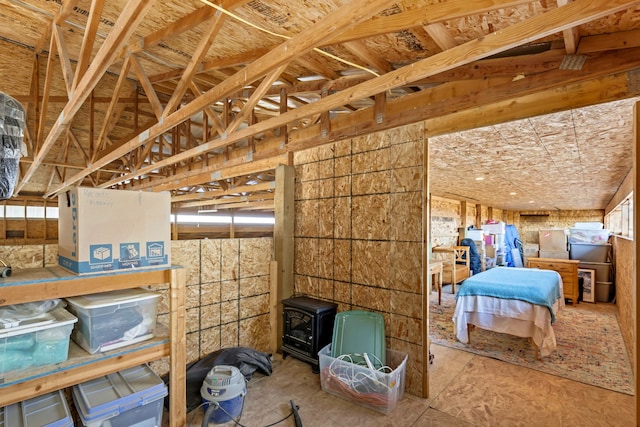 misc room with a wood stove