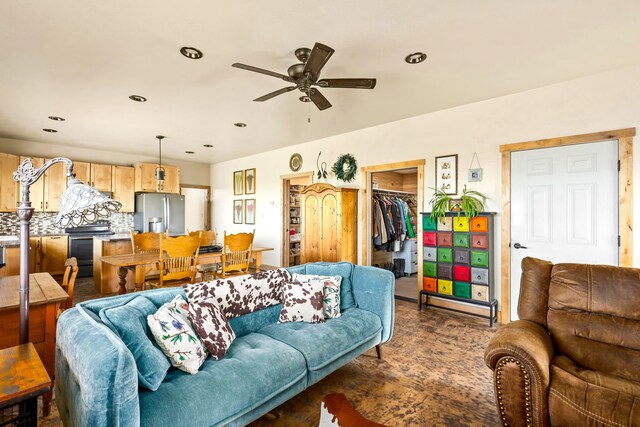 living area with recessed lighting and a ceiling fan