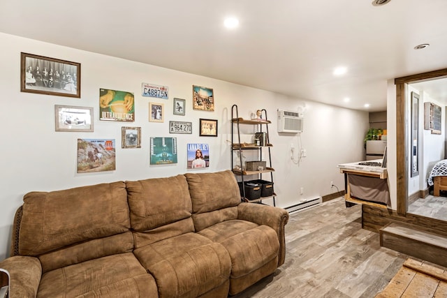 living room with light wood finished floors, baseboards, recessed lighting, baseboard heating, and a wall unit AC