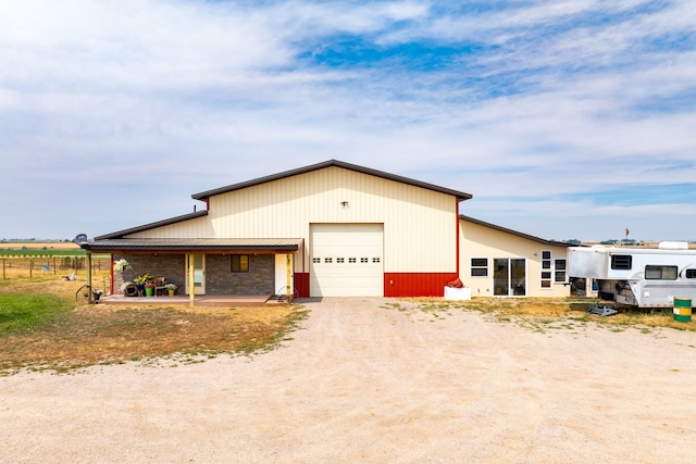 view of front of home featuring driveway and a garage