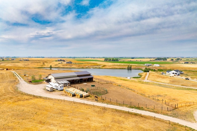 birds eye view of property with a water view and a rural view