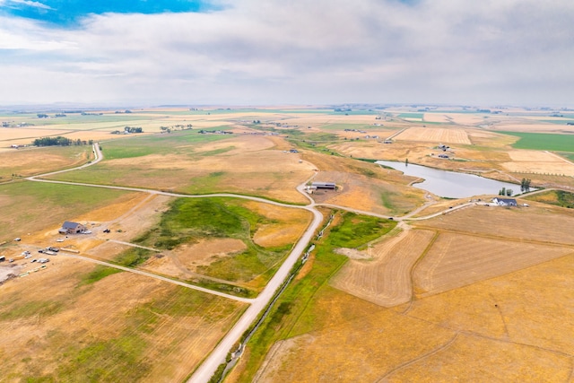 birds eye view of property with a rural view