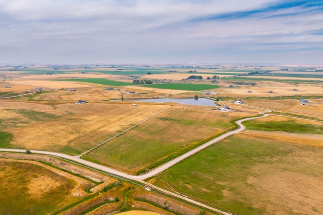bird's eye view with a water view and a rural view