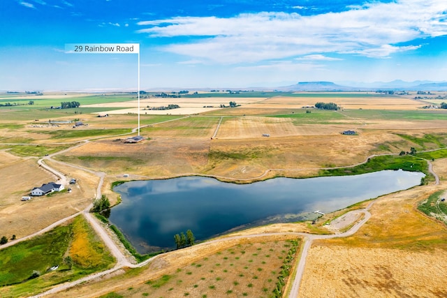 aerial view with a water view and a rural view