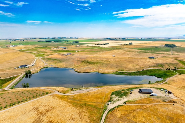 birds eye view of property with a water view and a rural view
