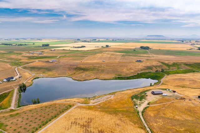 bird's eye view featuring a water view and a rural view
