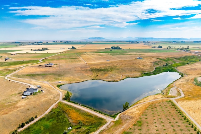 birds eye view of property with a water view and a rural view