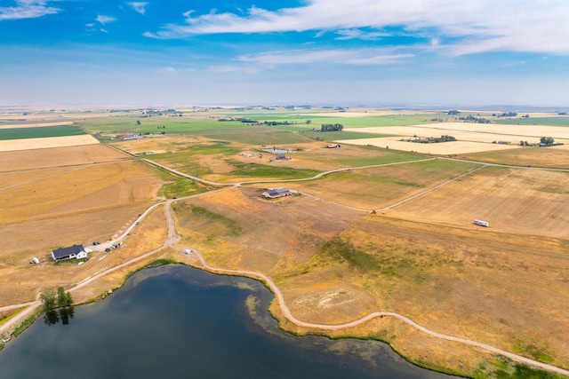 aerial view with a water view and a rural view