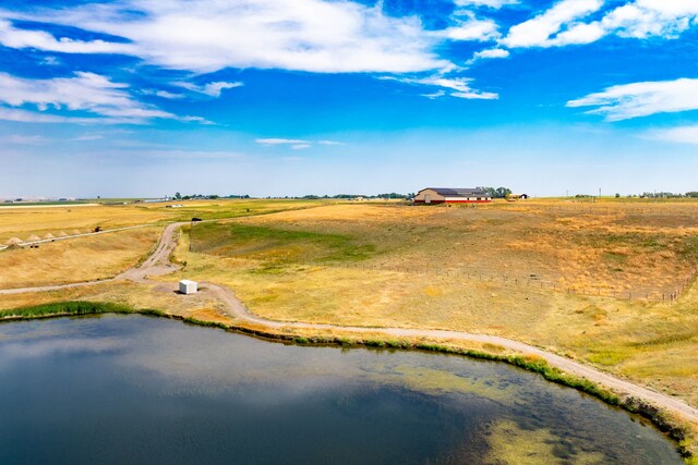 aerial view with a water view and a rural view