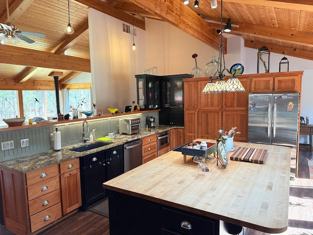 675 Bobcat Ln, Hamilton, MT 59840 - kitchen with a sink, wooden ceiling, lofted ceiling with beams, and stainless steel appliances