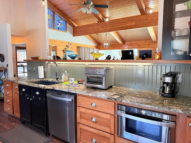 675 Bobcat Ln, Hamilton, MT 59840 - kitchen with a sink, a toaster, lofted ceiling with beams, dark wood-style floors, and stainless steel appliances