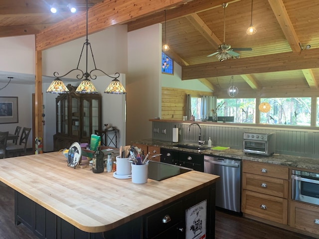 675 Bobcat Ln, Hamilton, MT 59840 - kitchen featuring wood ceiling, appliances with stainless steel finishes, a sink, beamed ceiling, and butcher block counters