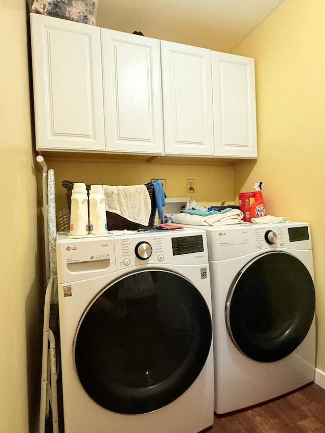 675 Bobcat Ln, Hamilton, MT 59840 - laundry room with cabinet space, baseboards, washer and clothes dryer, and wood finished floors