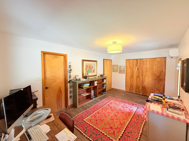 675 Bobcat Ln, Hamilton, MT 59840 - interior space featuring a wall mounted AC, wood finished floors, and a closet