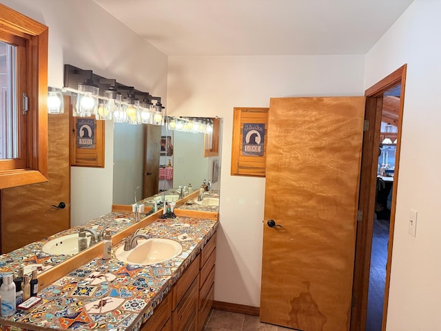 675 Bobcat Ln, Hamilton, MT 59840 - bathroom featuring vanity, baseboards, and tile patterned flooring