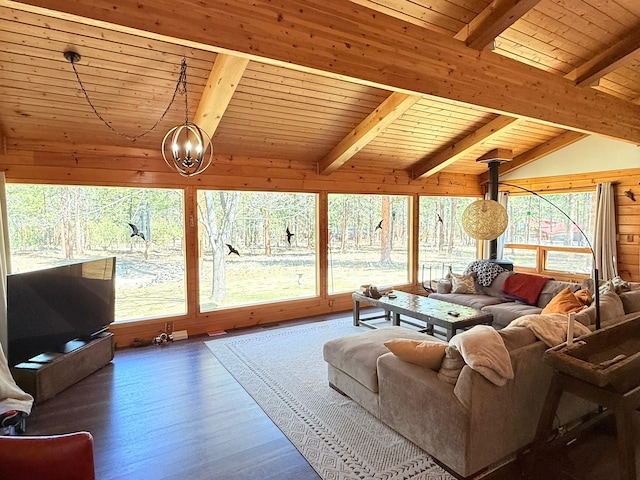 675 Bobcat Ln, Hamilton, MT 59840 - living area with wooden walls, an inviting chandelier, vaulted ceiling with beams, wood finished floors, and wood ceiling