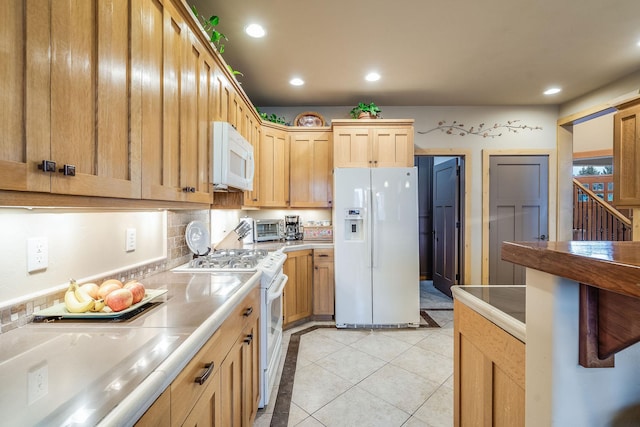kitchen with recessed lighting, white appliances, decorative backsplash, light tile patterned flooring, and light brown cabinets