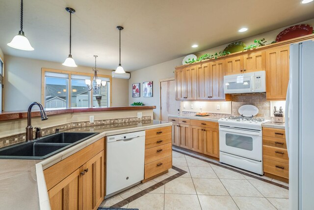 230 Camp Crook Ave, Kalispell, MT 59901 - kitchen with white appliances, recessed lighting, light tile patterned floors, light brown cabinetry, and tasteful backsplash