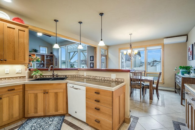 kitchen with vaulted ceiling, a sink, a peninsula, white dishwasher, and a wall mounted air conditioner