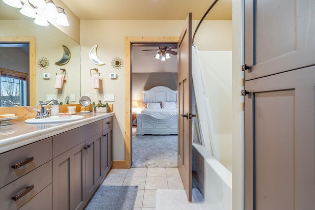 230 Camp Crook Ave, Kalispell, MT 59901 - bedroom featuring lofted ceiling, light colored carpet, ensuite bath, and ceiling fan
