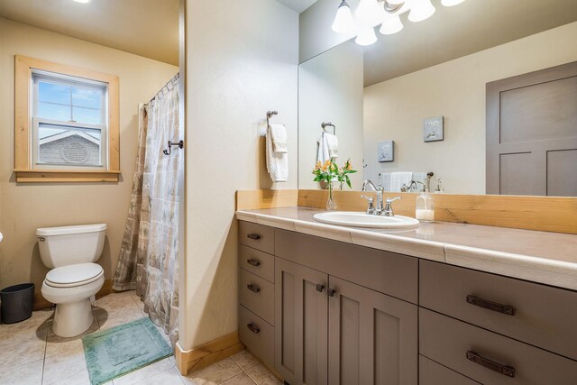 230 Camp Crook Ave, Kalispell, MT 59901 - full bathroom featuring vanity, toilet, tile patterned flooring, baseboards, and recessed lighting
