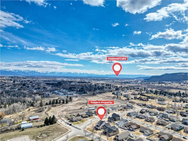 birds eye view of property with a residential view and a mountain view