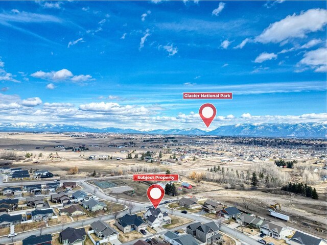 230 Camp Crook Ave, Kalispell, MT 59901 - aerial perspective of suburban area with a mountainous background