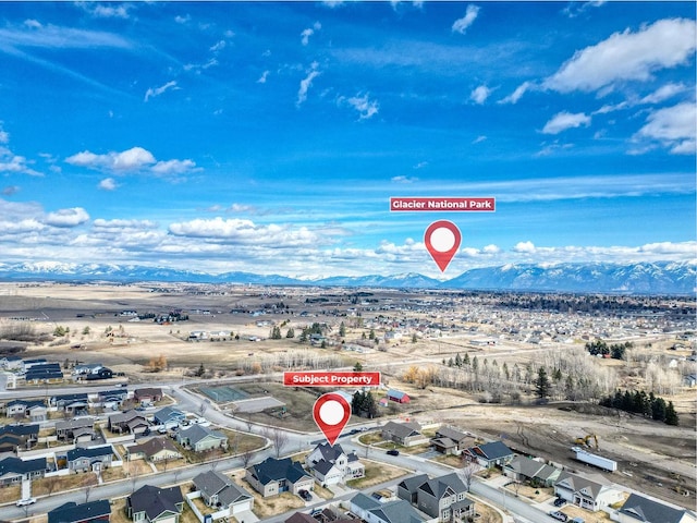birds eye view of property featuring a mountain view and a residential view
