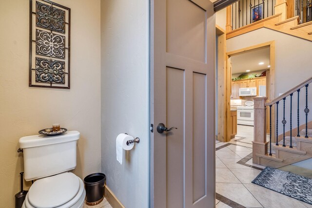 230 Camp Crook Ave, Kalispell, MT 59901 - foyer entrance with inlaid floor details, stairs, a chandelier, and light tile patterned floors