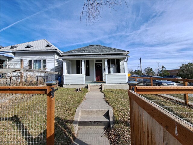 1026 11th Ave, Helena, MT 59601 - view of front of home with a porch and a shingled roof