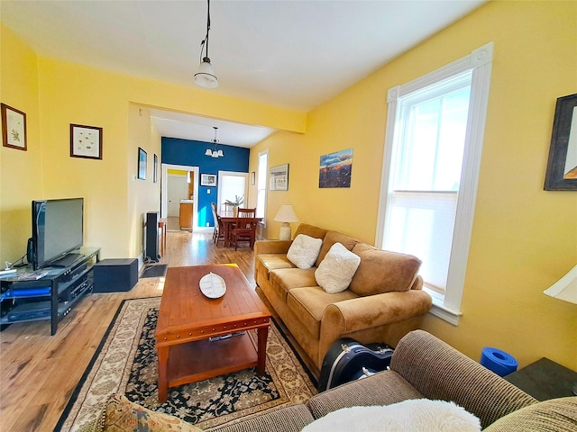 1026 11th Ave, Helena, MT 59601 - living room with light wood-type flooring and a chandelier