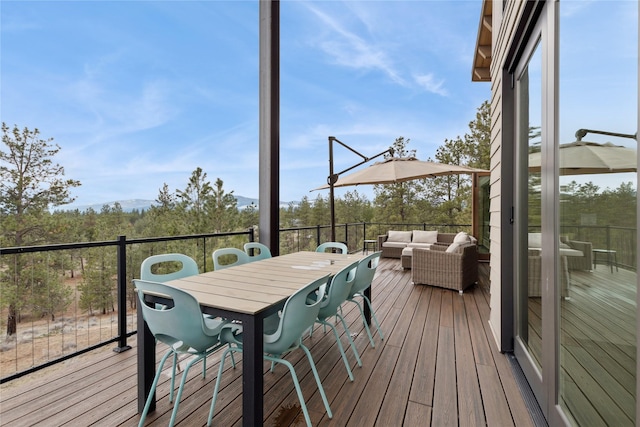 280 Cowgirl Cv, Eureka, MT 59917 - wooden deck with outdoor dining area and outdoor lounge area
