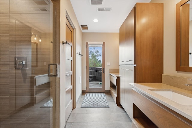 280 Cowgirl Cv, Eureka, MT 59917 - bathroom featuring tile patterned floors, vanity, a shower stall, and visible vents