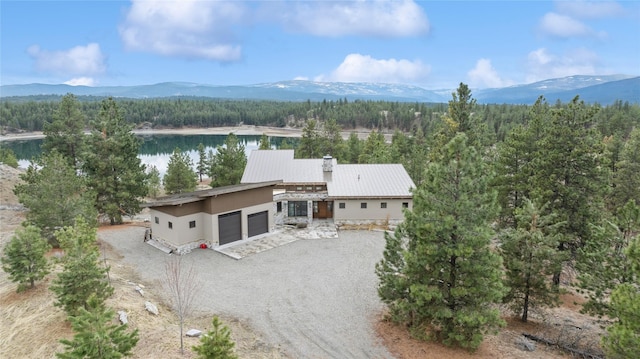 280 Cowgirl Cv, Eureka, MT 59917 - drone / aerial view featuring a forest view and a water and mountain view