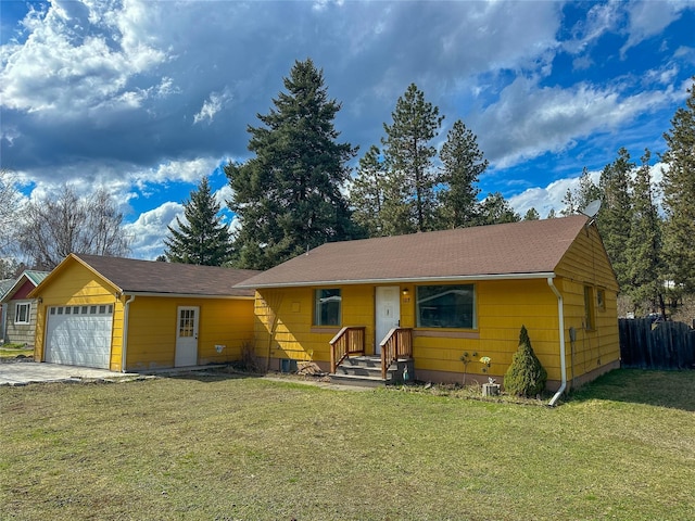 single story home featuring a front yard, fence, and an attached garage