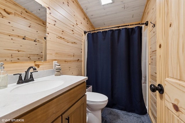 full bath with toilet, vanity, wooden ceiling, and wooden walls