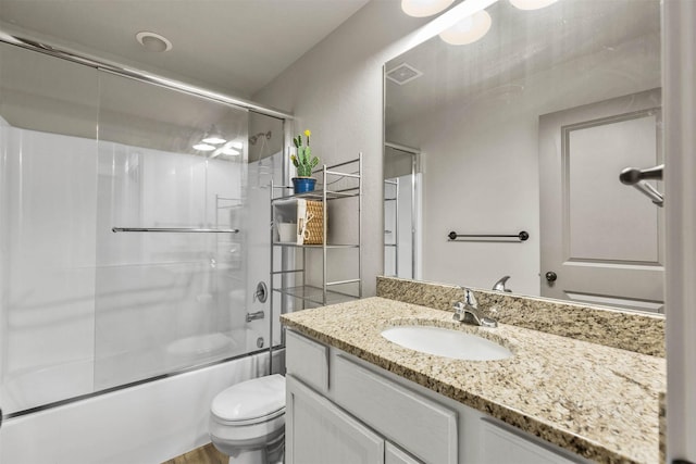 4239 W Babcock St Unit 7, Bozeman, MT 59718 - full bathroom featuring toilet, shower / bath combination with glass door, and vanity