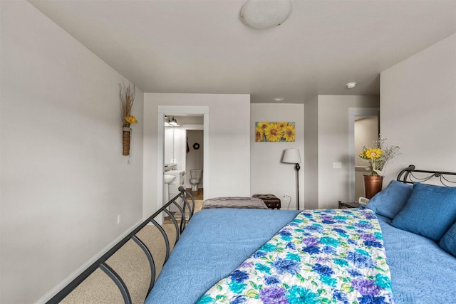 4239 W Babcock St Unit 7, Bozeman, MT 59718 - carpeted bedroom featuring ensuite bath and baseboards