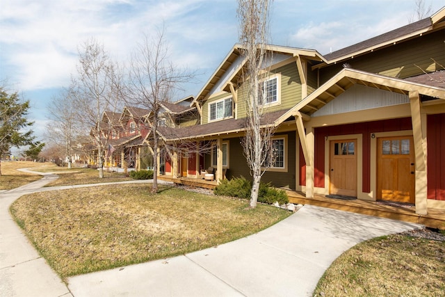 4239 W Babcock St Unit 7, Bozeman, MT 59718 - craftsman-style house featuring a porch and a front yard