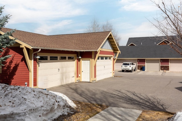 4239 W Babcock St Unit 7, Bozeman, MT 59718 - exterior space with a garage and a shingled roof