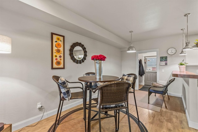 4239 W Babcock St Unit 7, Bozeman, MT 59718 - dining area featuring baseboards and light wood-type flooring