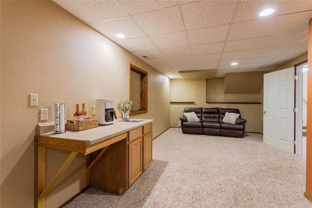 bar featuring light carpet, a paneled ceiling, baseboards, and recessed lighting
