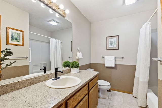 full bathroom with tile patterned flooring, toilet, vanity, and a shower with curtain