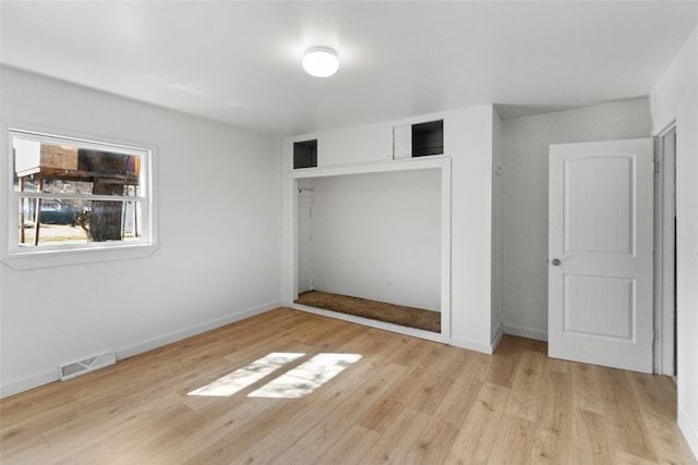 602 16th Ave E, Polson, MT 59860 - unfurnished bedroom featuring wood finished floors, a closet, and baseboards