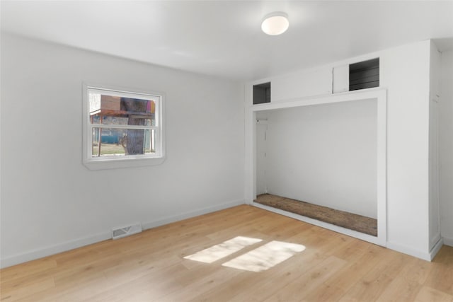 602 16th Ave E, Polson, MT 59860 - unfurnished bedroom featuring wood finished floors and baseboards