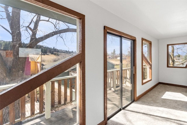 602 16th Ave E, Polson, MT 59860 - entryway with healthy amount of natural light, carpet floors, and baseboards