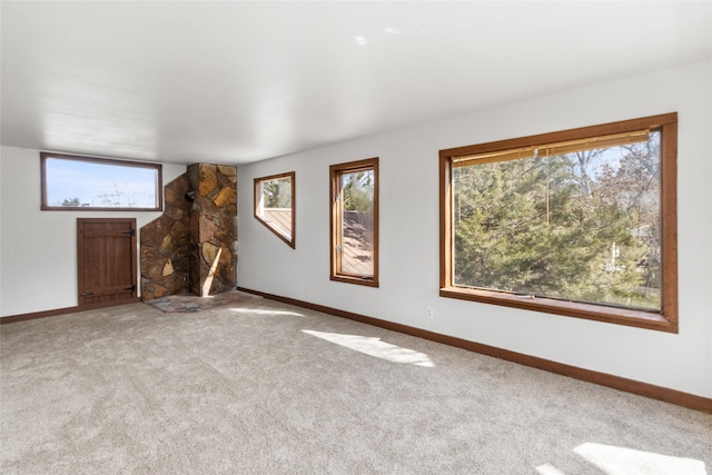 602 16th Ave E, Polson, MT 59860 - unfurnished living room featuring plenty of natural light and carpet flooring