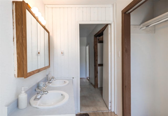 602 16th Ave E, Polson, MT 59860 - bathroom with double vanity and wood finished floors