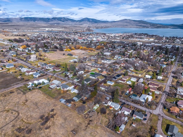 602 16th Ave E, Polson, MT 59860 - aerial view of property and surrounding area with a water and mountain view and nearby suburban area