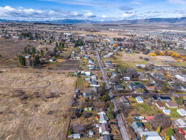 602 16th Ave E, Polson, MT 59860 - aerial view of property's location with mountains and nearby suburban area